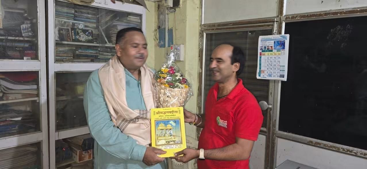 Felicitation ceremony with bouquet and book