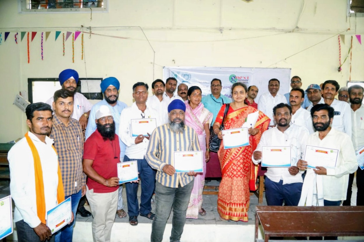Group of trainees holding completion certificates
